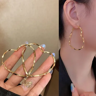 Exaggerated Heart-shaped Twisted Hollow Design Alloy Hoop Earrings