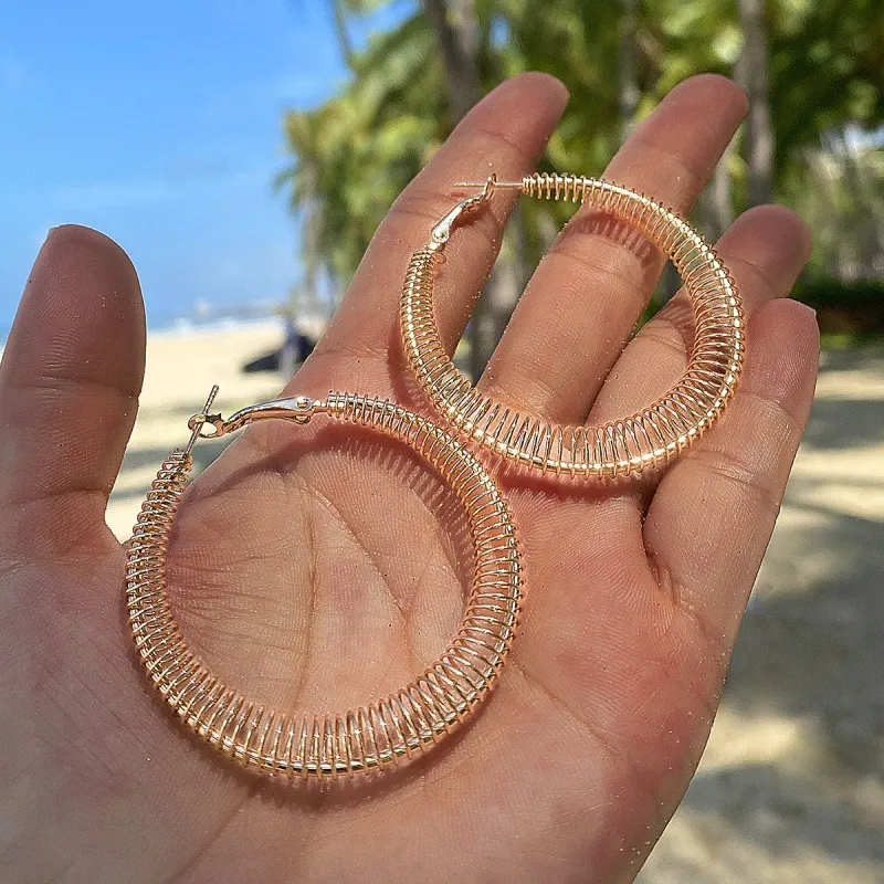 Exaggerated Spring Shape Hollow Design Solid Color Alloy Hoop Earrings